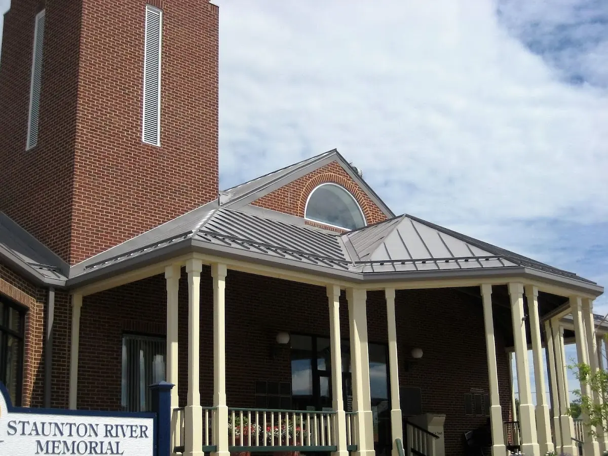 Skilled roofing craftsmen working on a residential roof in Ridgely